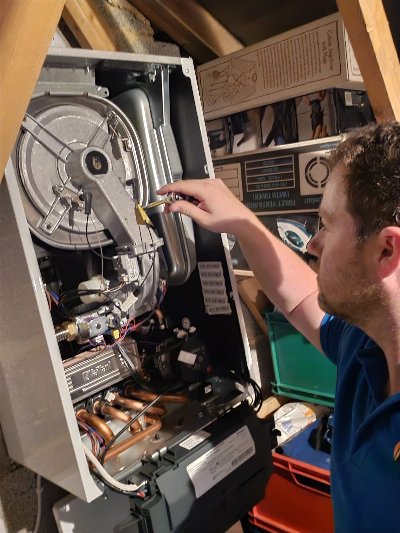 Bay Plumbing and Heating engineer carrying out a Vaillant boiler service in Paignton