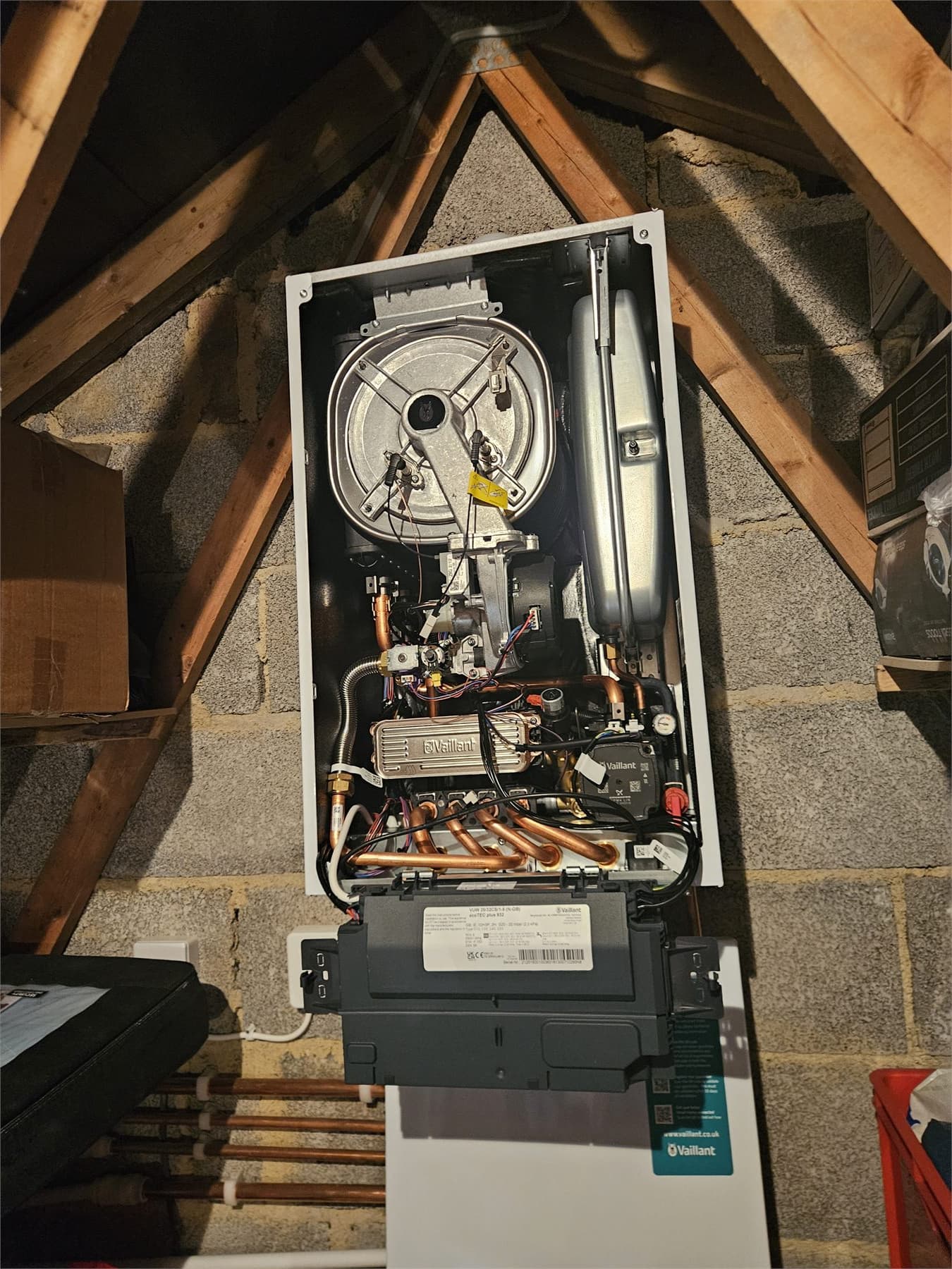 Open Vaillant boiler during annual servicing in a Paignton loft