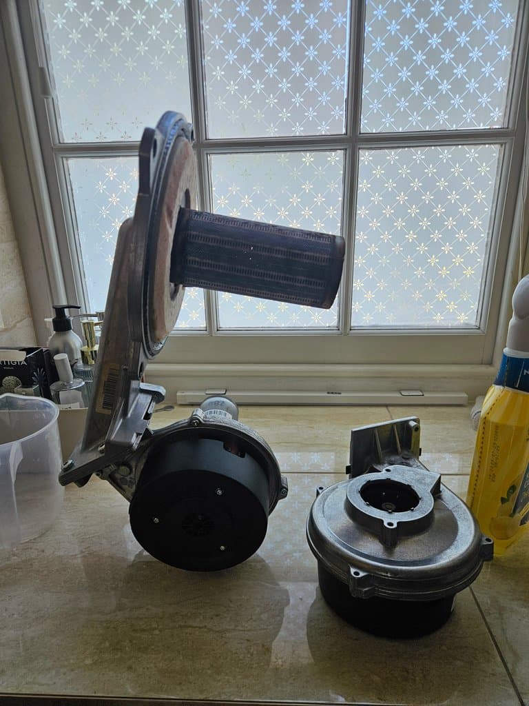 Old and new Glow-worm boiler fan side by side during fan replacement in Torquay