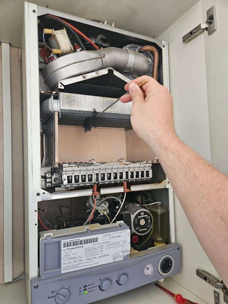 Potterton boiler opened and cleaned during annual servicing in Torquay