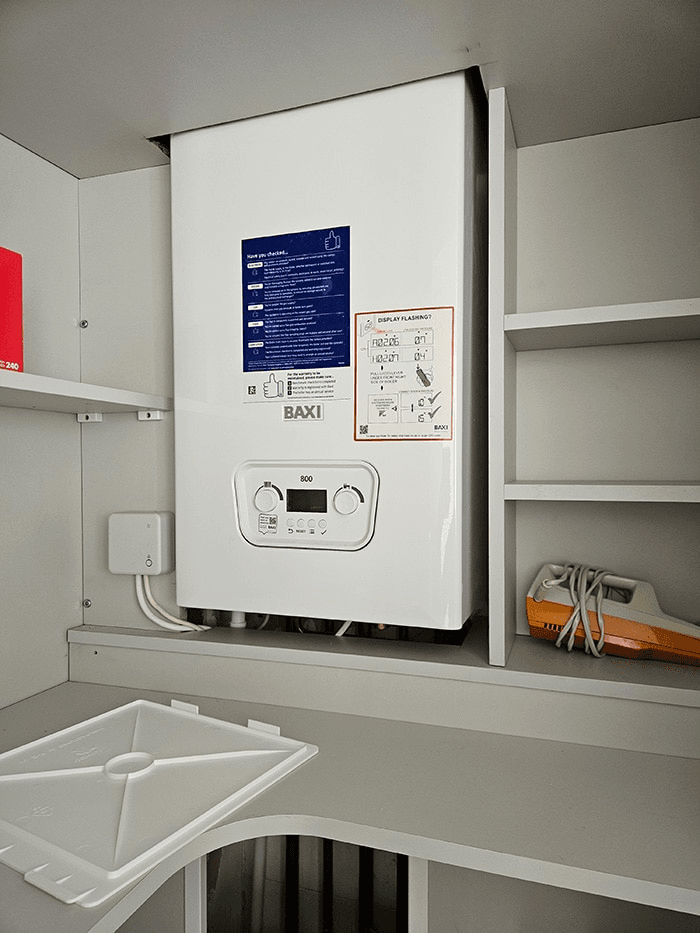 Real Baxi boiler installation in a cupboard by Bay Plumbing and Heating